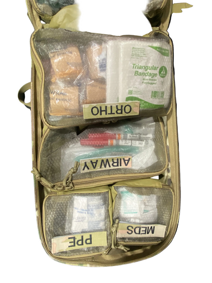 Open first aid kit with various supplies in a beige bag on a white background