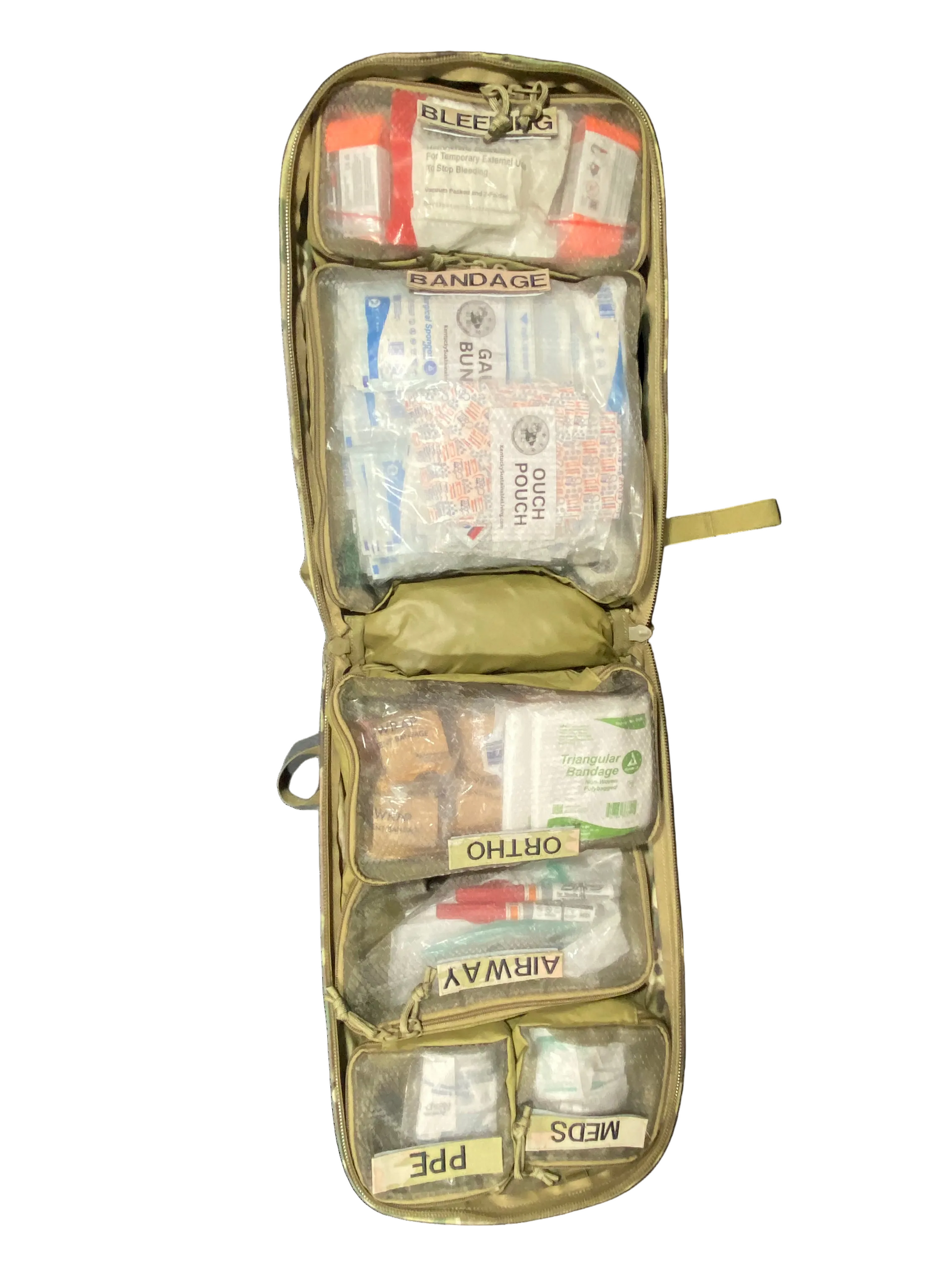 Open first aid kit with various supplies on a white background