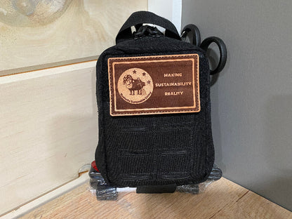 Black IFAK with a brown Kentucky Sustainable Living patch