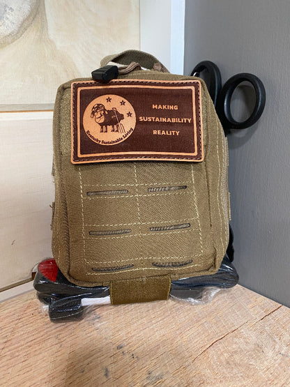 Coyote tan backpack with a brown Kentucky Sustainable Living patch