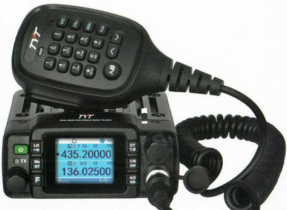 Black TYT dual-band radio with keypad and microphone on a white background